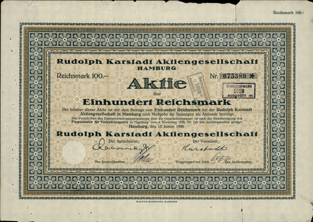 Ein altes deutsches Banknoten mit einem schwarzen Hintergrund und dem Text "Rudolph Karlstadt Aktiengesellschaft Hamburg" darauf geschrieben.