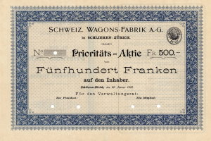 Altes deutsches Aktienzertifikat mit blauem Rand, das den Text 'Schweiz Wagons-Fabrik A.G.' enthält