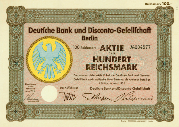 Eine alte deutsche Banknote mit einer Vogeldarstellung und der Aufschrift "Deutsche Bank und Disconto-Gefellichaft Berlin".