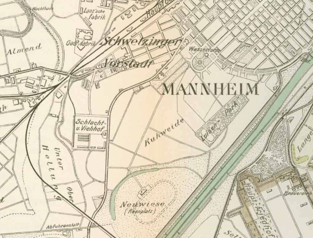 Ein detailliertes altes Stadtplan von Mannheim, Deutschland, mit Stra√üen, Geb√§uden und Landmarken in Blaut√∂nen, Gr√ľn und Gelb gekennzeichnet.