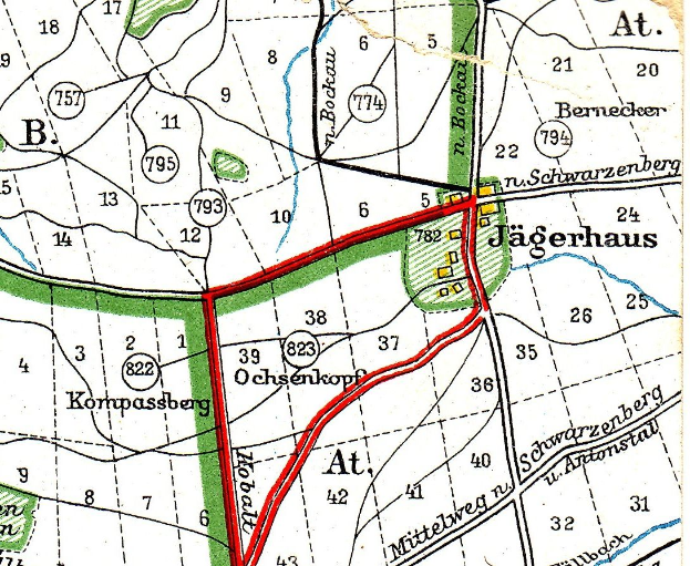 Ein detaillierter alter Stadtplan von Jagerhaus, Deutschland, mit Straßen, Gebäuden, Sehenswürdigkeiten und einer roten Linie hindurch.