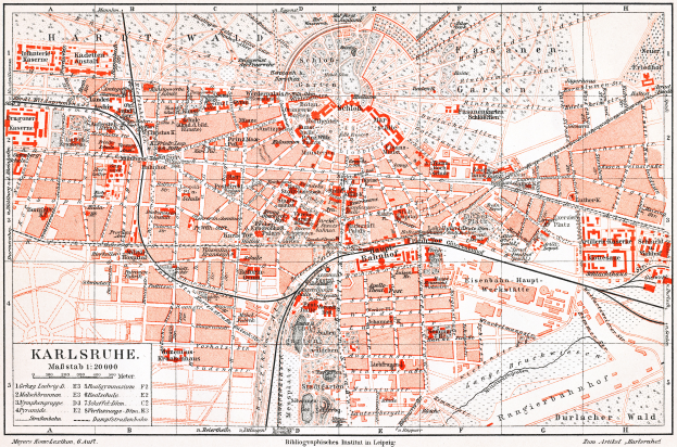 Ein detaillierter Stadtplan von Karlsruhe, Deutschland aus dem Jahr 1900 mit Text und umfassender Stadtaufteilung.