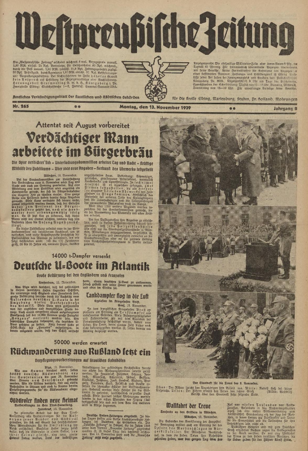 Schwarze-Weiß-Titelseite einer deutschen Zeitung vom 13. November 1939 mit der Überschrift 'Weitpreubliche Zeitung', die eine Gruppe von Menschen in traditioneller deutscher Tracht in einer feierlichen Umgebung zeigt.