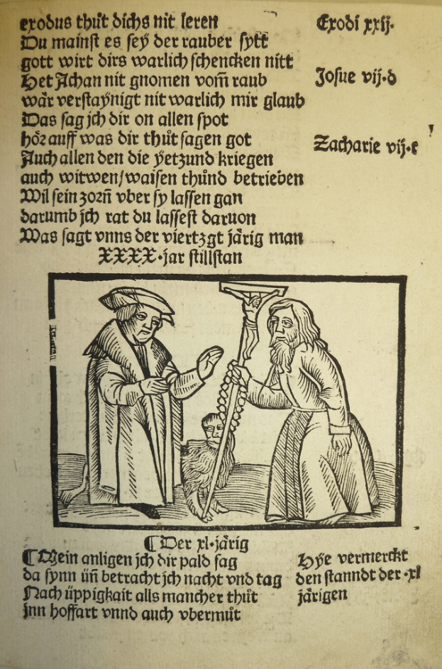 Ein Blatt mit gedrucktem Text in einer unbekannten Sprache, mit zwei Männern im Hintergrund, möglicherweise aus einem Lehrbuch.